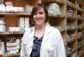 pharmacy technician in white lab coat